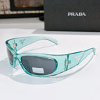 Prada teal acetate glasses with dark lenses and gold-toned logo details