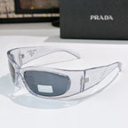 Prada clear frame glasses with dark gray lenses and metal logo hardware