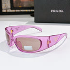 Pink eyeglass frames with PRADA logo on temples and tinted lenses