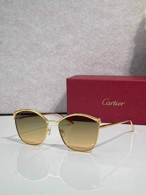 Cartier sunglasses with gold round frames and amber-tinted lenses