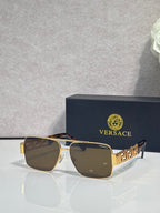 Versace sunglasses with gold frame and brown lenses, Greek-key temple accents