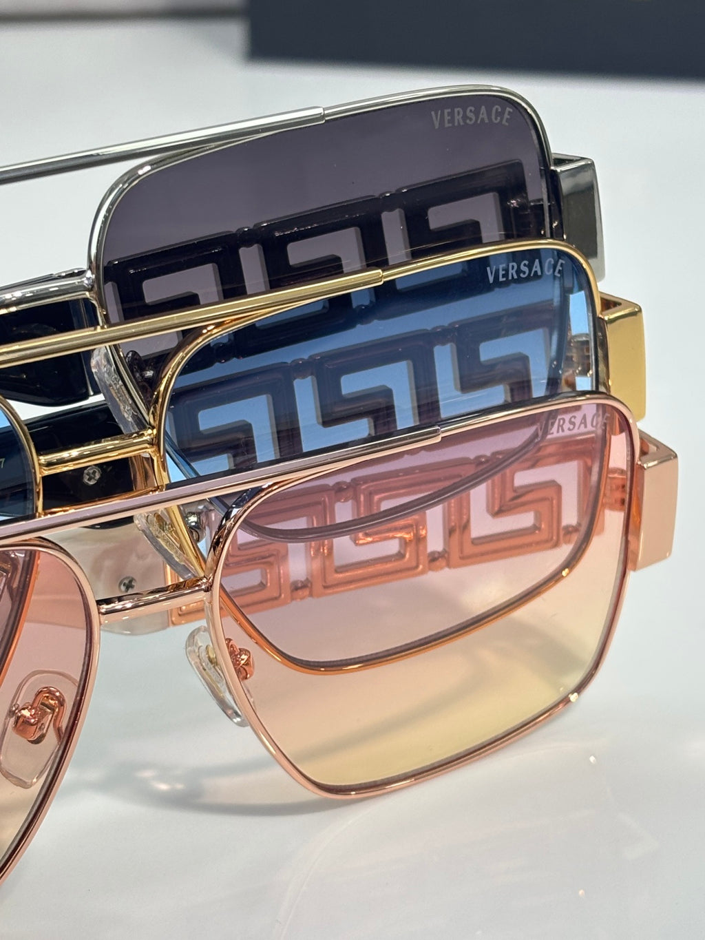 Versace sunglasses close-up of temples with Greek-key pattern and tinted lens