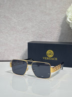 Versace sunglasses with gold frame and dark blue lenses, Greek-key temple accents