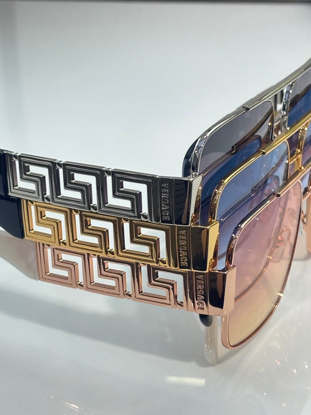 Versace sunglasses side view with gold and dark blue geometric temple design