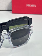 Black square sunglasses with dark lens and clear frame edge