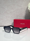 Black square sunglasses with dark lenses and white side arms