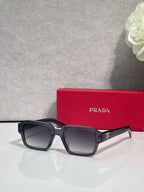Black square sunglasses with gradient dark lenses on red case