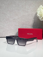 Prada square sunglasses with dark frames and dark smoke lenses