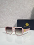Versace square sunglasses with light pink frame and mauve tinted lenses, gold logo