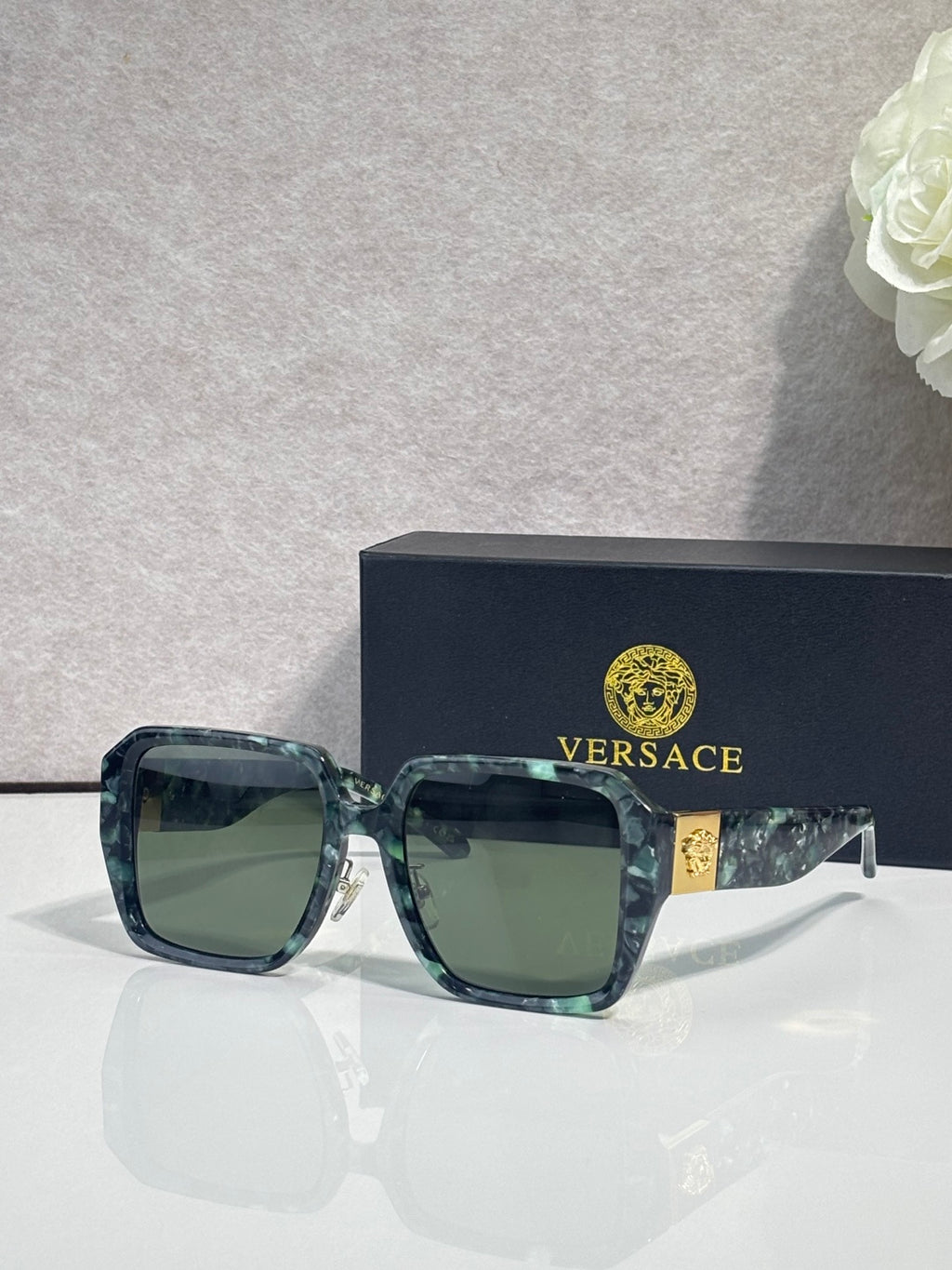 Versace square sunglasses with teal gradient frame and green tinted lenses, gold logo