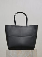 YSL black tote bag with two top handles and stitched panel front