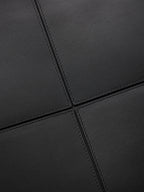 YSL black leather-look tote bag close-up of stitched seam panel