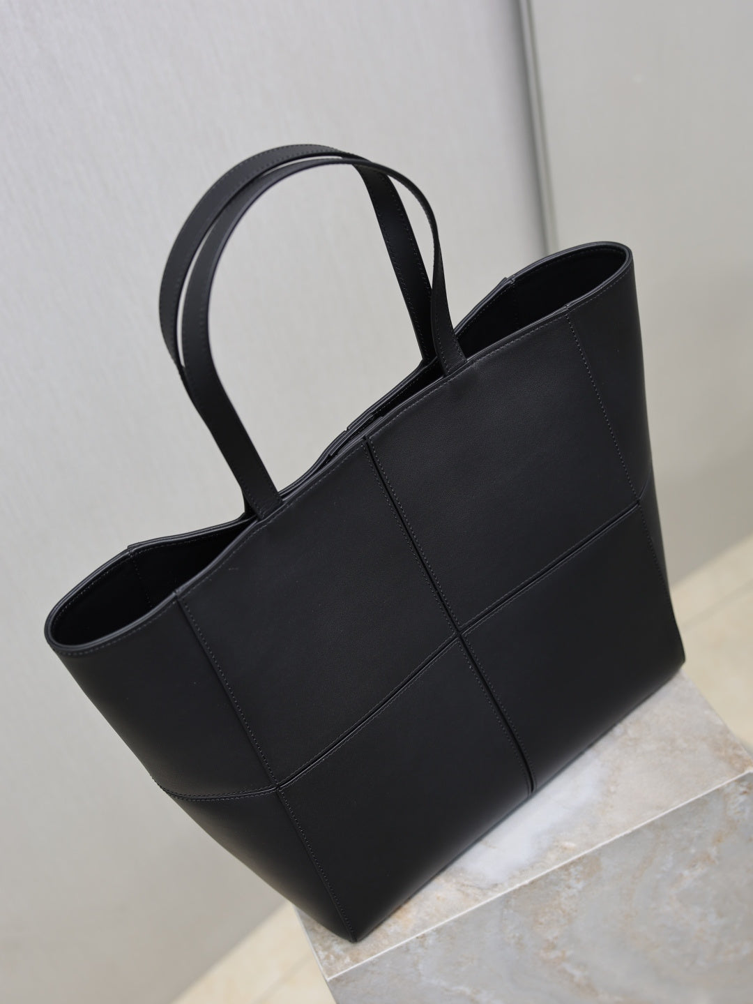 YSL black tote bag with top handles, open-top silhouette and stitched panels