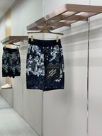 Louis Vuitton checkered shorts in blue and white pixel pattern, elastic waistband