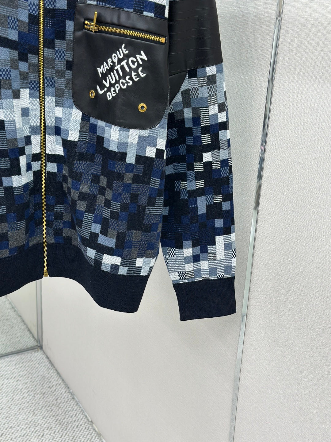 Zip-up jacket lower front and pockets in blue/white check knit, navy cuffs