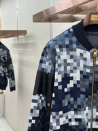 Zip-up jacket sleeve and side panel in blue/white check knit with gold zipper trim