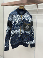 Zip-up jacket with blue/white check knit, black chest pocket, gold zipper
