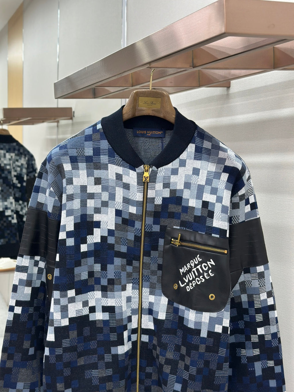 Zip-up jacket with blue/white check knit, Louis Vuitton chest pocket, gold zipper