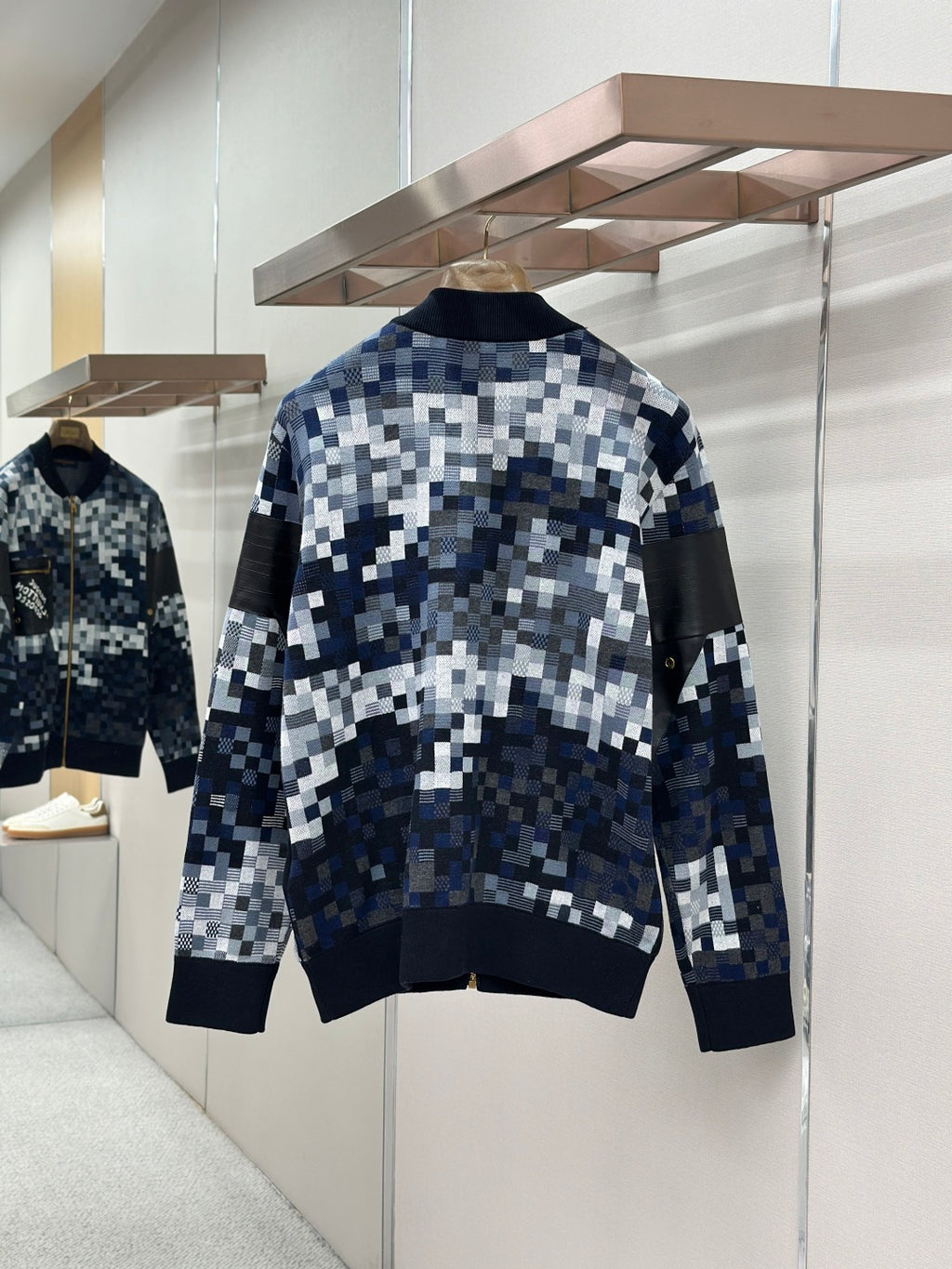 Zip-up jacket back view with blue/white check knit pattern and stand collar