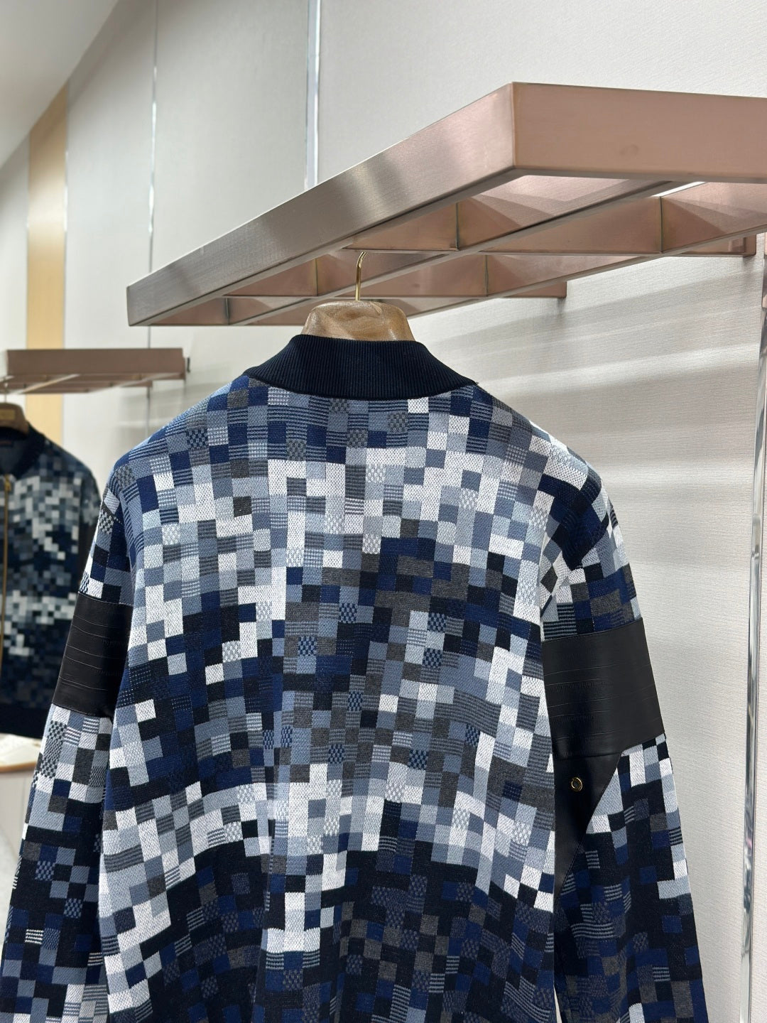Zip-up jacket back with blue/white check knit pattern and ribbed cuffs