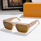 Sunglasses with beige frames and brown lenses, gold LV logo on temples.