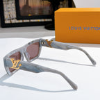 Side view sunglasses with translucent blue frames, pink lenses, gold LV logo.