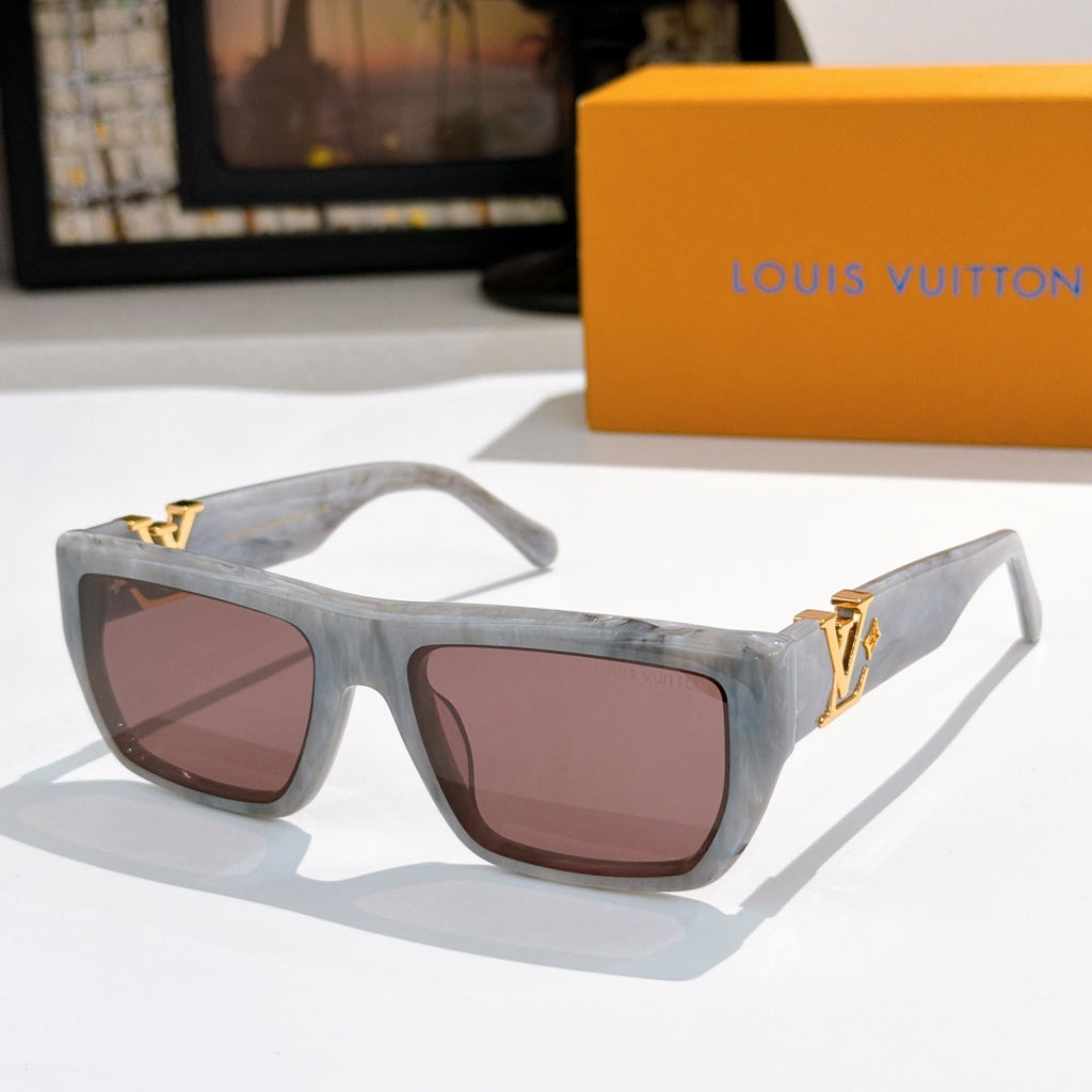 Sunglasses with translucent light blue frames and pink lenses, gold LV logo.