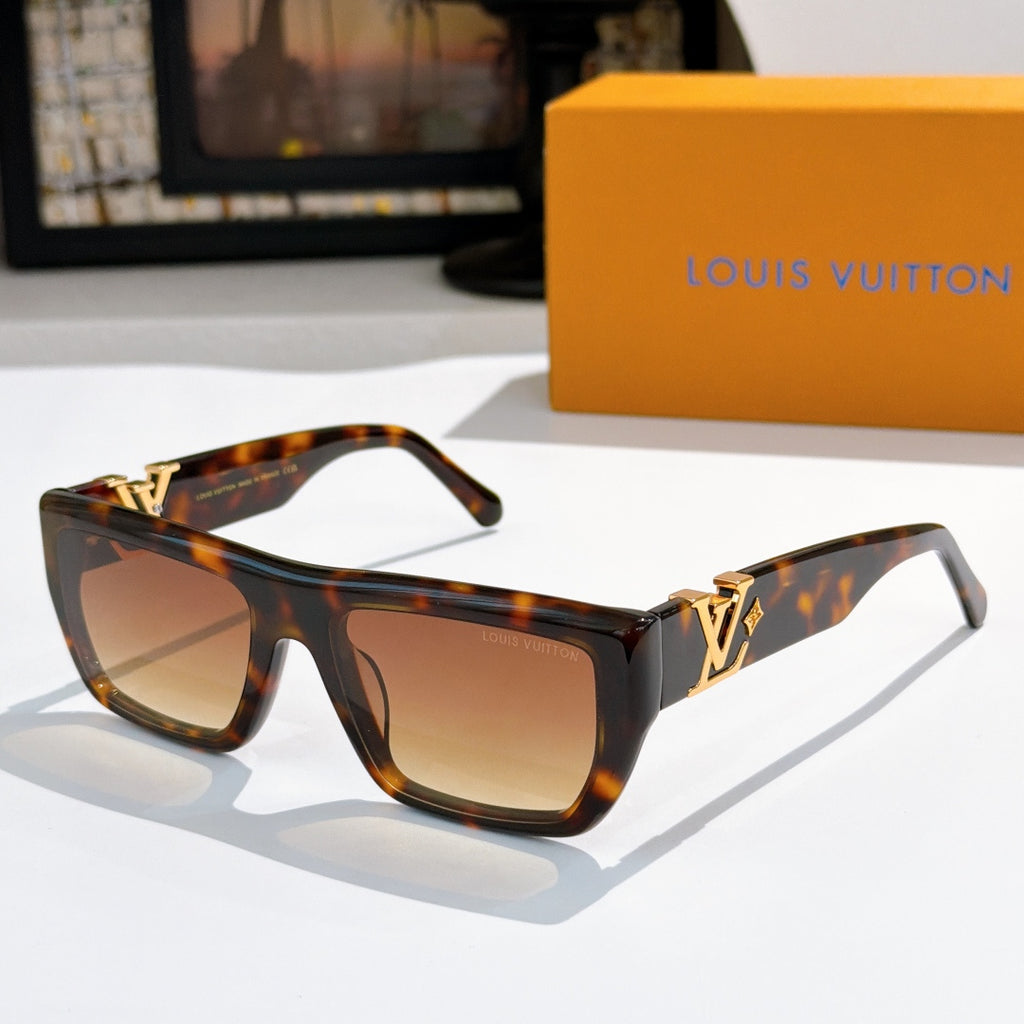 Sunglasses with tortoiseshell frames and amber lenses, gold LV logo on temples.