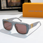 Louis Vuitton glasses with translucent gray frames and brown tinted lenses