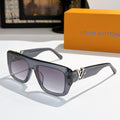 Louis Vuitton glasses with dark blue frames and purple tinted lenses