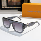 Louis Vuitton glasses with dark blue frames and purple tinted lenses