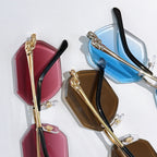 Cartier sunglasses close-up: pink and blue octagonal lenses with gold frames