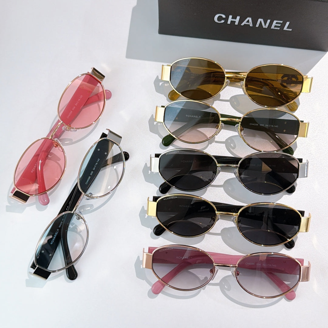 Assorted sunglasses set with pink, clear, black, and gold frames; Chanel logo temples.