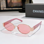 Pink round sunglasses with rose lenses and gold accents; Chanel logo on temple.