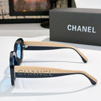 Chanel sunglasses side view with black frame, beige-tan arms, and dot-studded stripe