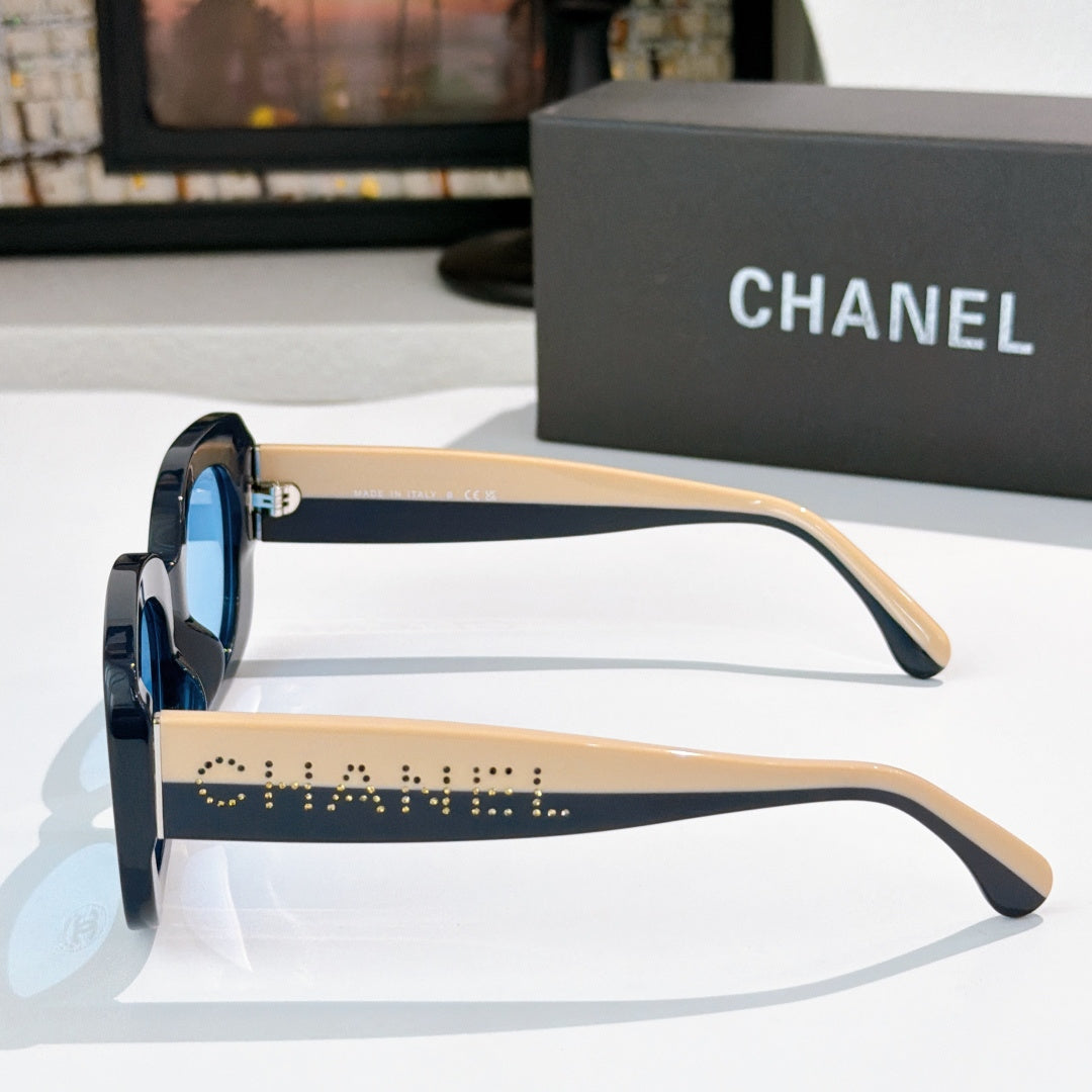 Chanel sunglasses side view with black frame, beige-tan arms, and dot-studded stripe