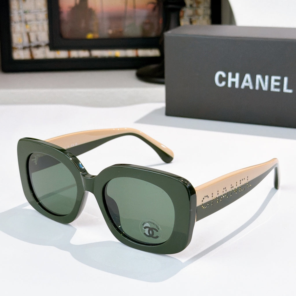 Chanel sunglasses with dark green frame and green tinted lenses, rounded oversized shape
