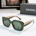 Chanel sunglasses with dark green frame and green tinted lenses, rounded oversized shape