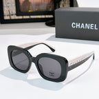 Chanel sunglasses with black frame and gray tinted lenses, beige-tan arms with dot pattern
