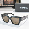 Square black sunglasses with brown tinted lenses and silver logo detail