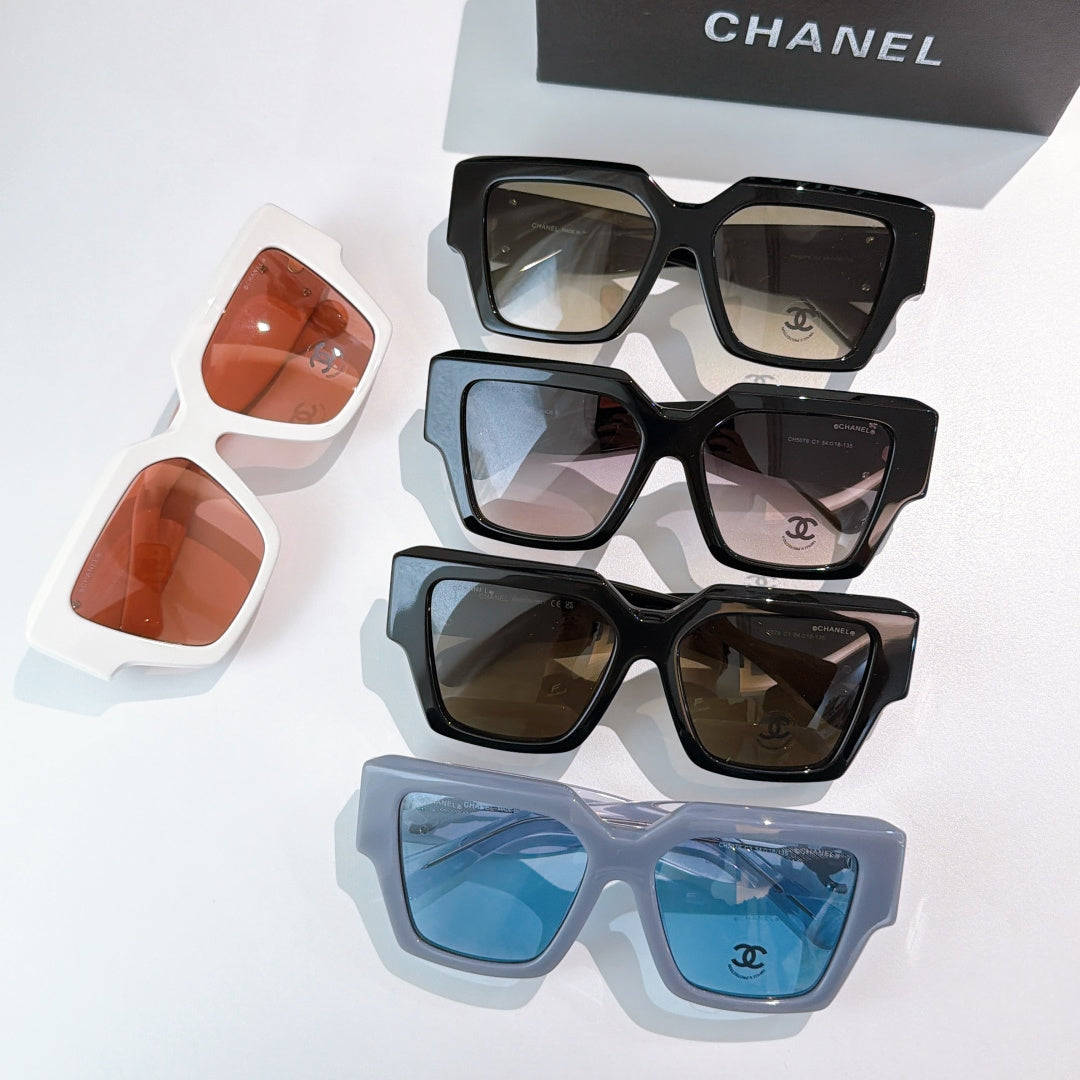 Assorted square sunglasses with orange, blue, brown, and black tinted lenses