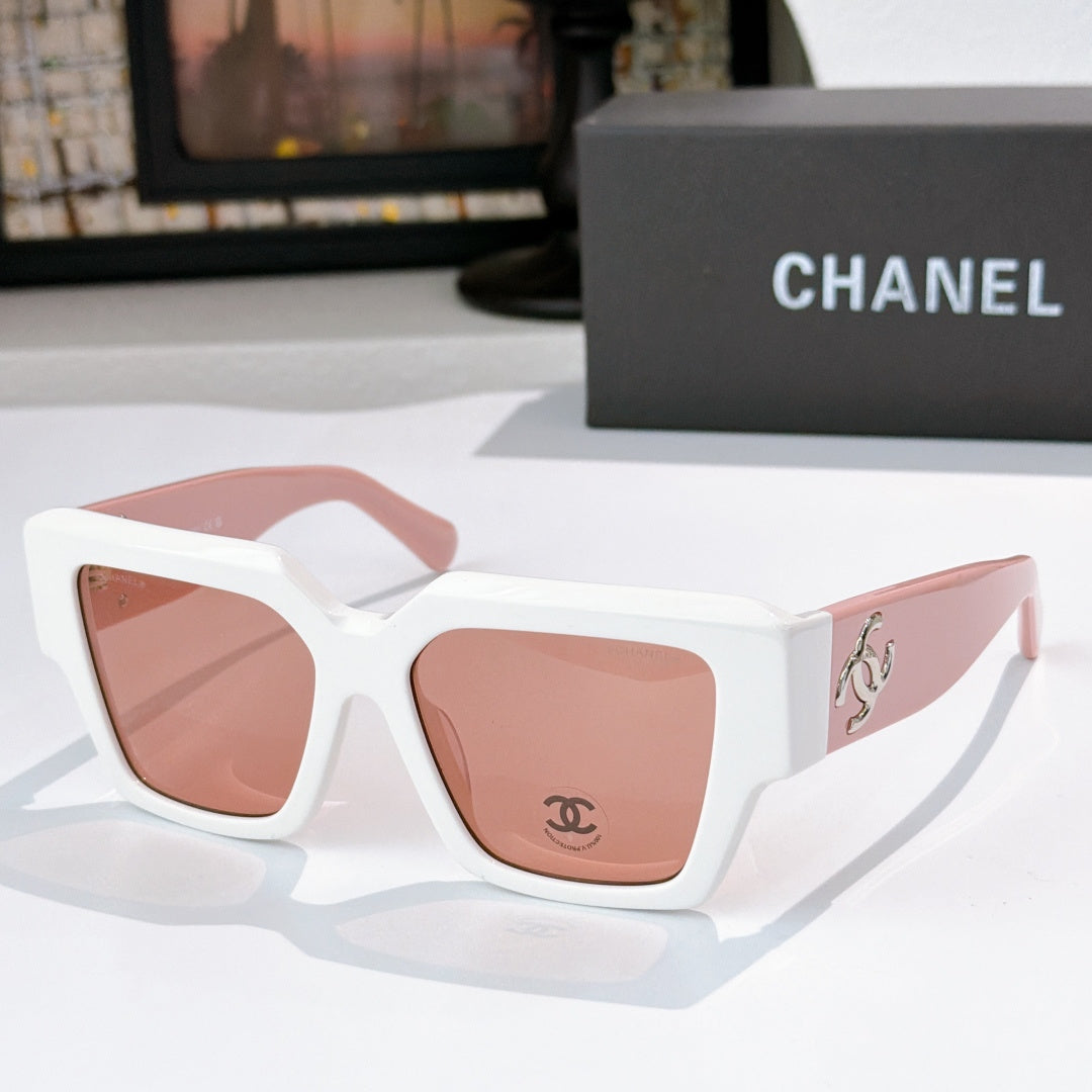 Square white sunglasses with pink tinted lenses and silver logo detail