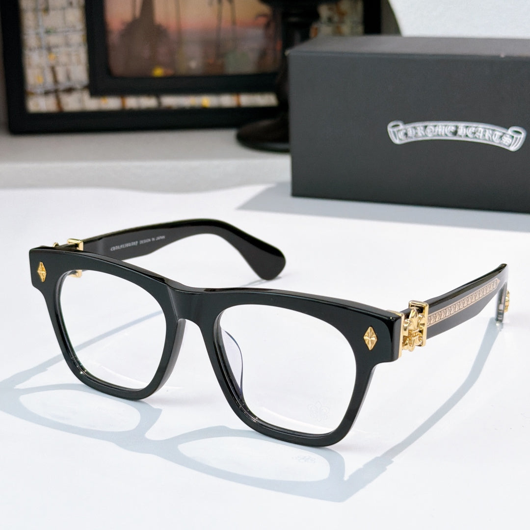 Black eyeglasses with gold-tone hinges and temple logo detail.
