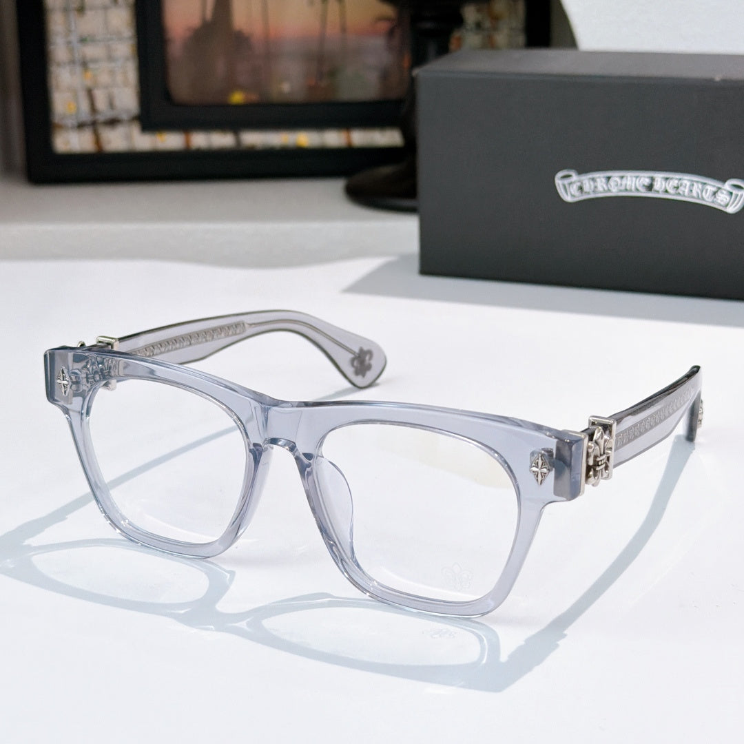 Light silver/clear eyeglasses with gold-tone hinges and textured temple arms.
