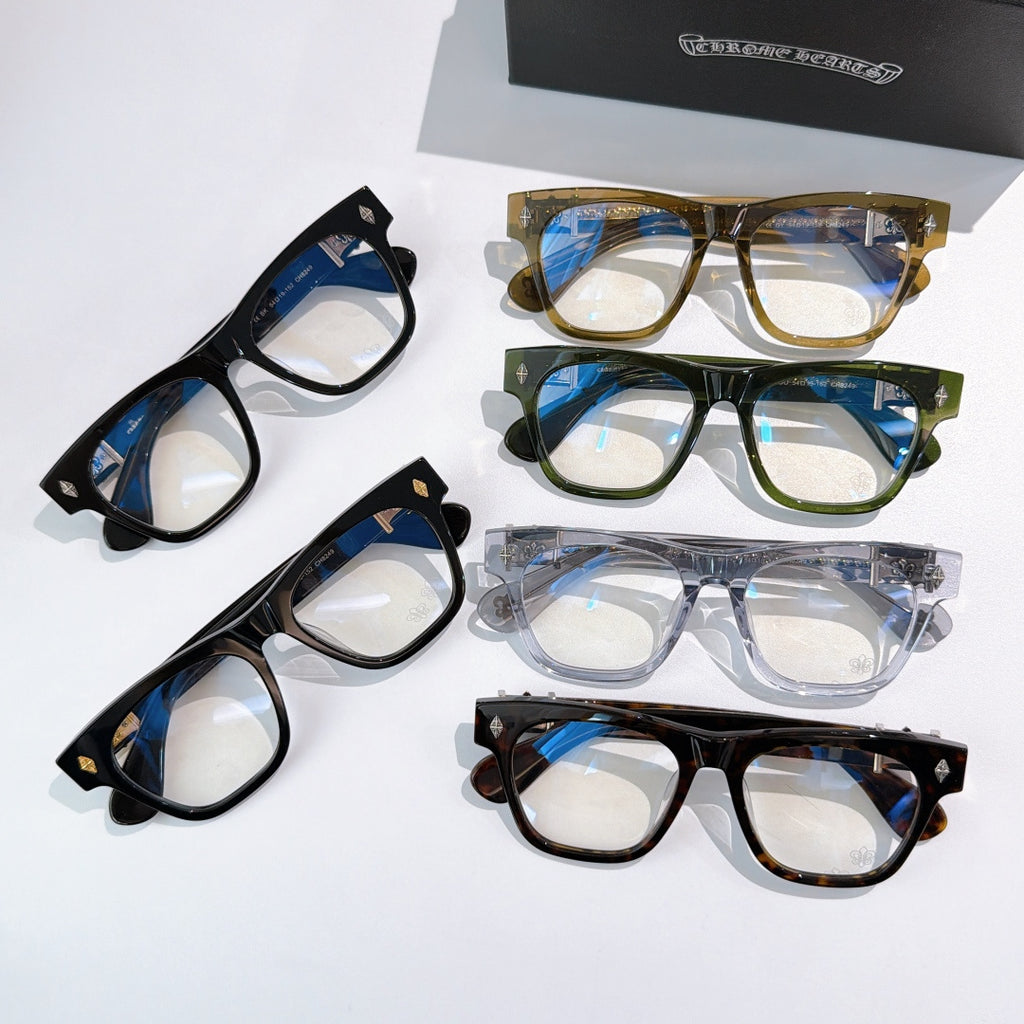 Assorted eyeglasses in black, blue, and tortoise frames with gold-tone hinges.