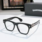 Black eyeglasses with gold-tone hinges and curved temple arms.