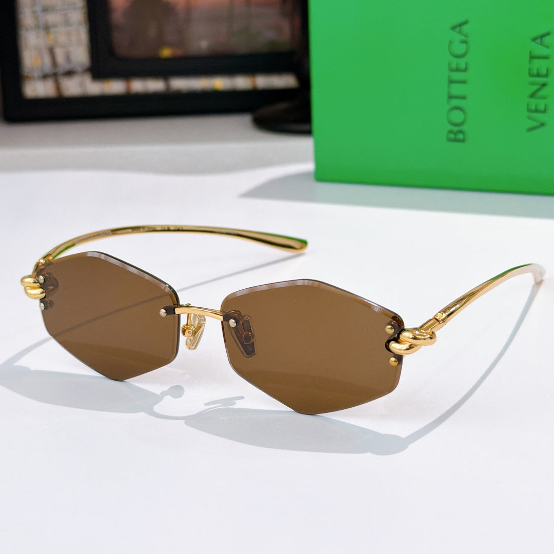 Gold metal sunglasses with warm tan lenses and curved temple arms