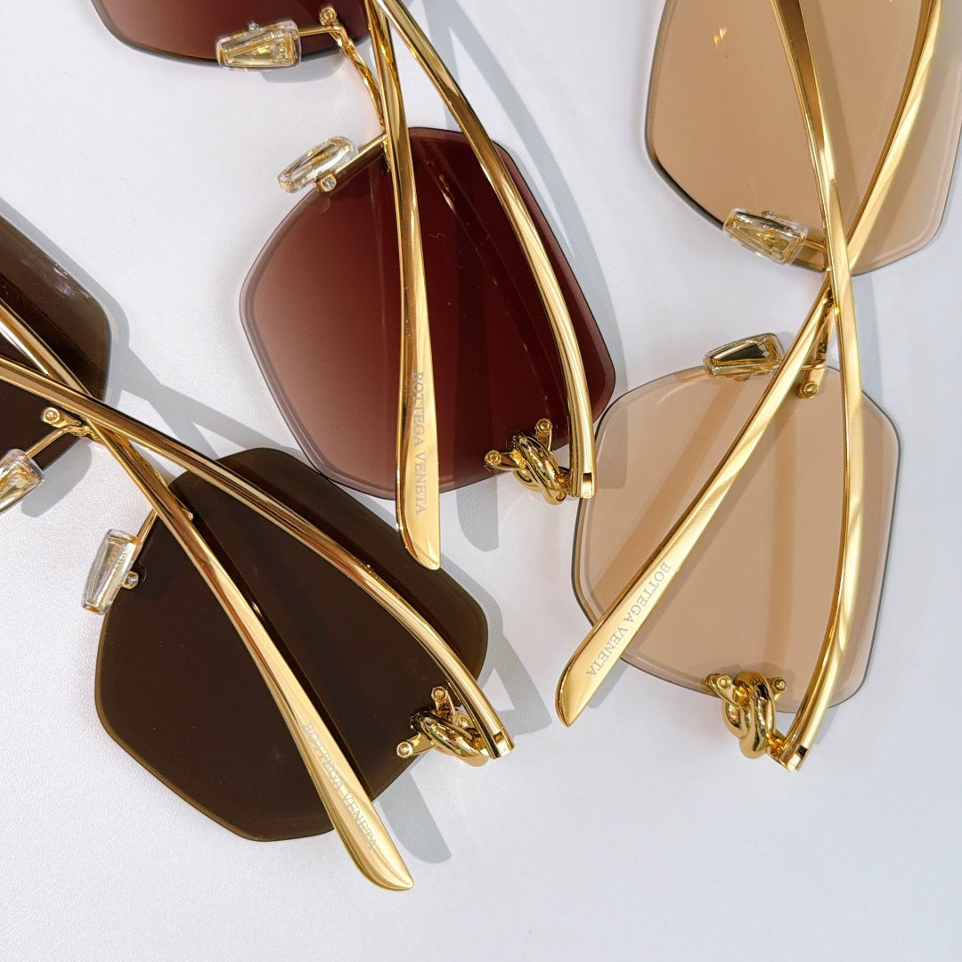 Bottega Veneta sunglasses detail, gold-tone temples and assorted lens tints.