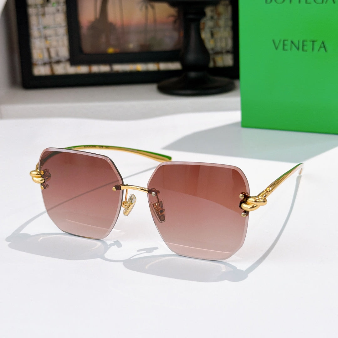 Bottega Veneta sunglasses, blush pink lenses, gold-tone metal frame.