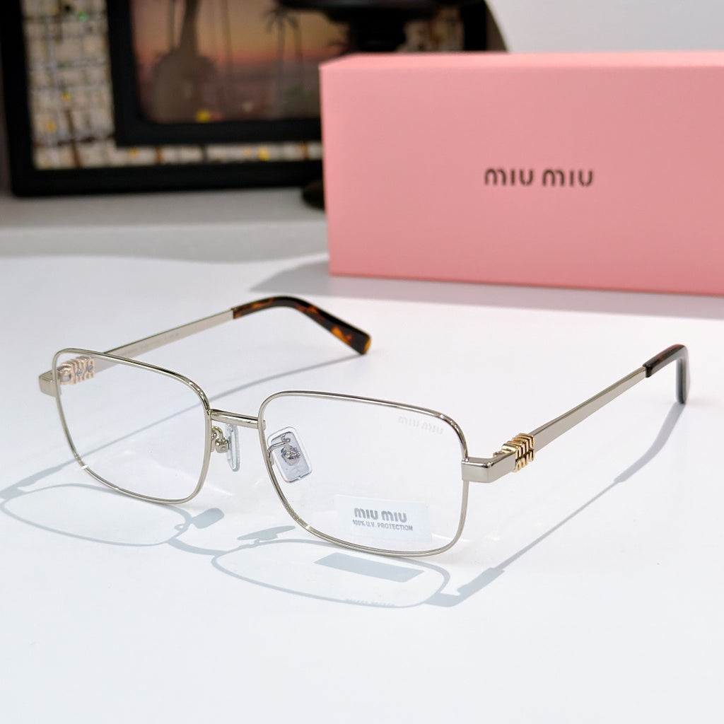 MiuMiu glasses with gold-tone frame and clear lenses, tortoise accents